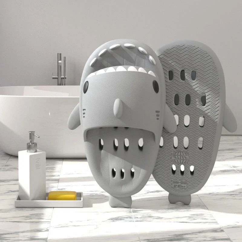 Colorful shark-themed shower slides with drainage holes, designed for comfortable and practical use in the pool or shower.