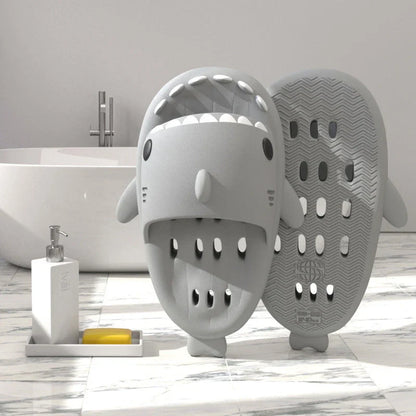 Colorful shark-themed shower slides with drainage holes, designed for comfortable and practical use in the pool or shower.