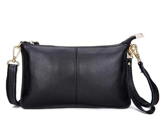 Lady's cowhide slant bag in apricot colour showing front view with strap and compact 24 cm size.