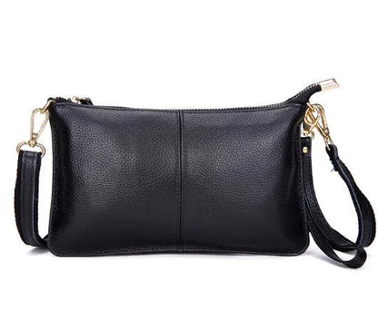 Lady's cowhide slant bag in apricot colour showing front view with strap and compact 24 cm size.