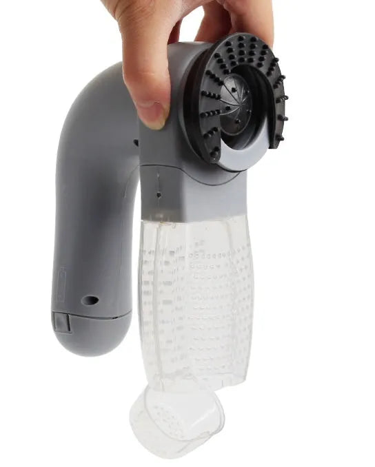 Grey portable pet hair vacuum cleaner with soft rubber head for grooming cats and dogs.