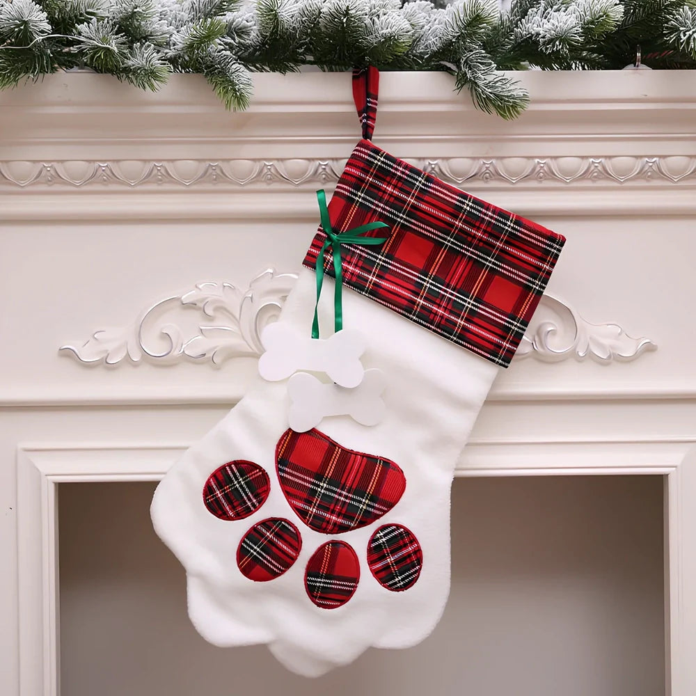 Red dog paw shaped Christmas stocking measuring 20cm by 46cm with reinforced hanging loop