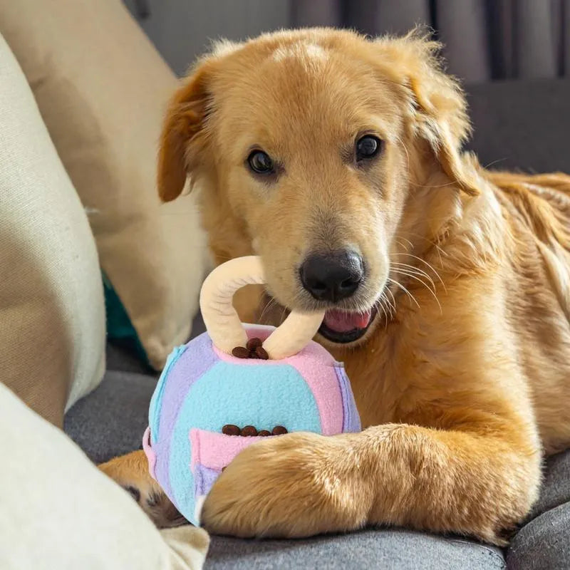 Pink and green squeaky plush ball dog toy with treat pockets for interactive play