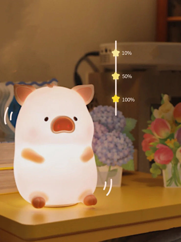 Pink silicone pig night light with USB charging cable, dimensions 180x145x130mm