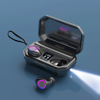 Black and white wireless Bluetooth in-ear headphones with a charging cabin showing an LED power display.