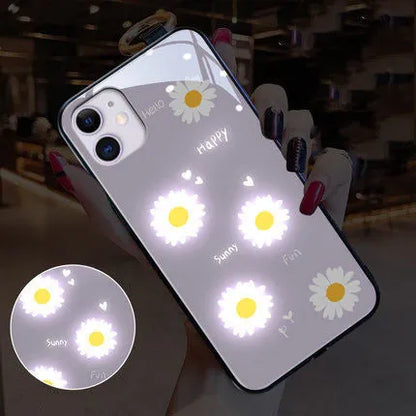 White luminous iPhone case with purple daisy design showing voice-activated colour light illumination around edges