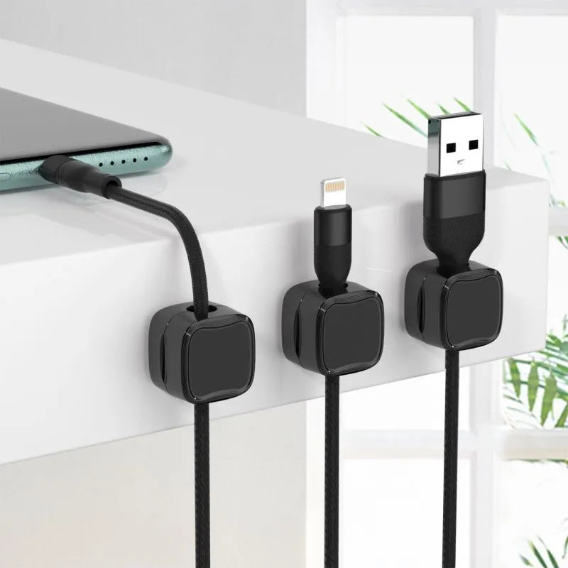 Black and white magnetic cable clips for under desk cable management with adhesive backing