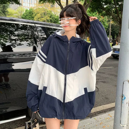 Women's lightweight hooded sun protection coat in blue, red, or orange