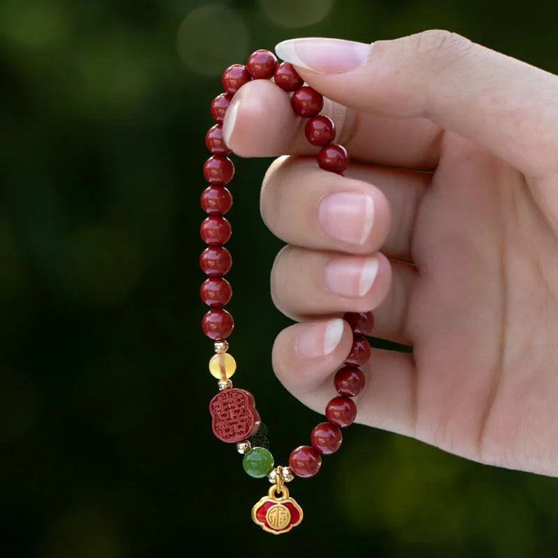 Emperor Sandstone bracelet with fu character, available in 6mm or 8mm cinnabar beads.