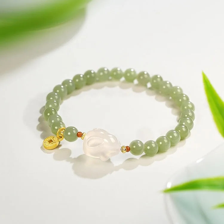 Handmade Hetian jade rabbit charm bracelet for women in glass or coloured glaze with a sweet rabbit design.