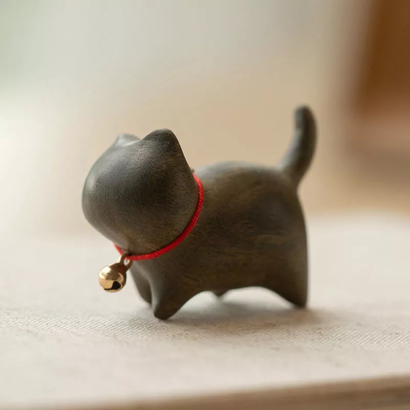 Handmade green sandalwood kitten ornament with unique design