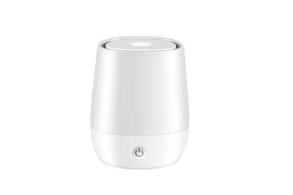 White USB aroma diffuser humidifier with simulated flame light effect on a table.
