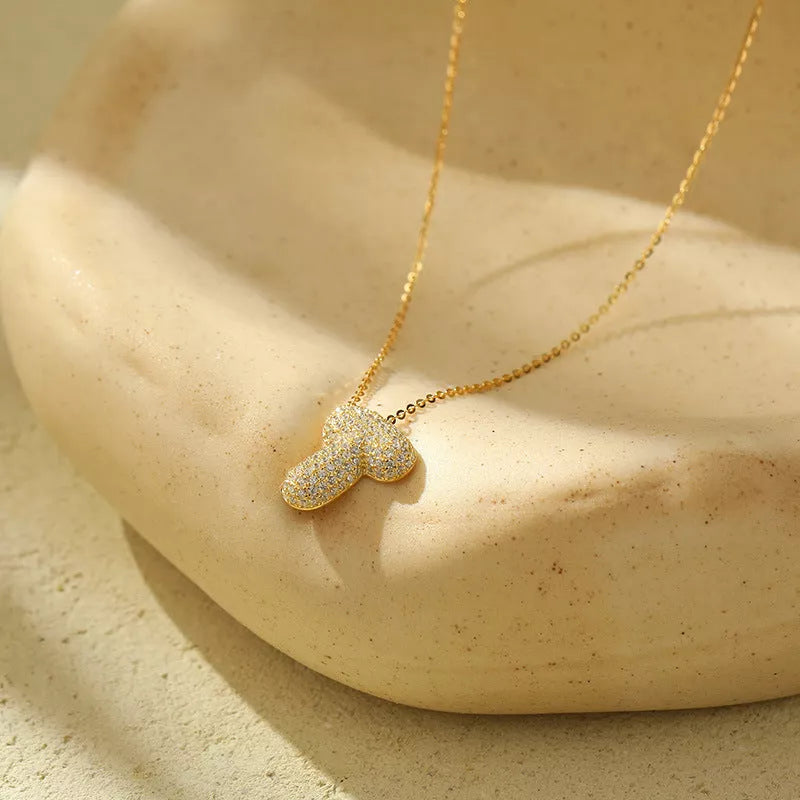 Stainless steel initial pendant necklace with zircon accents, personalized with your choice of letter.