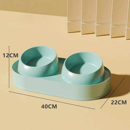 White elevated pet double bowl feeder with tilted food and water bowls on a non-slip stand.