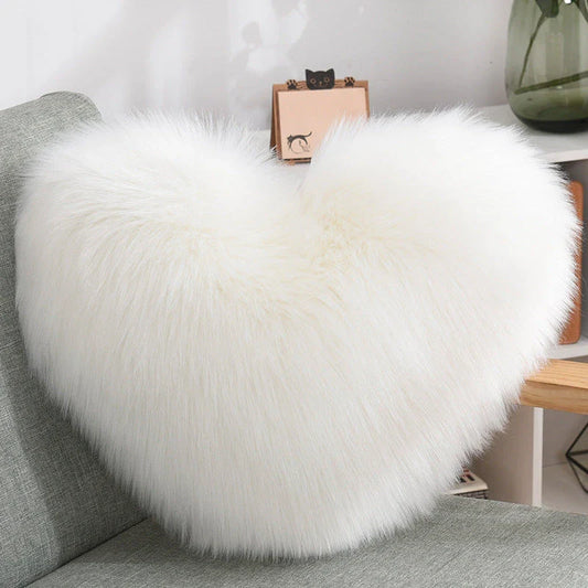 Cozy heart-shaped plush throw pillows in various colors and sizes for living room and bedroom decor