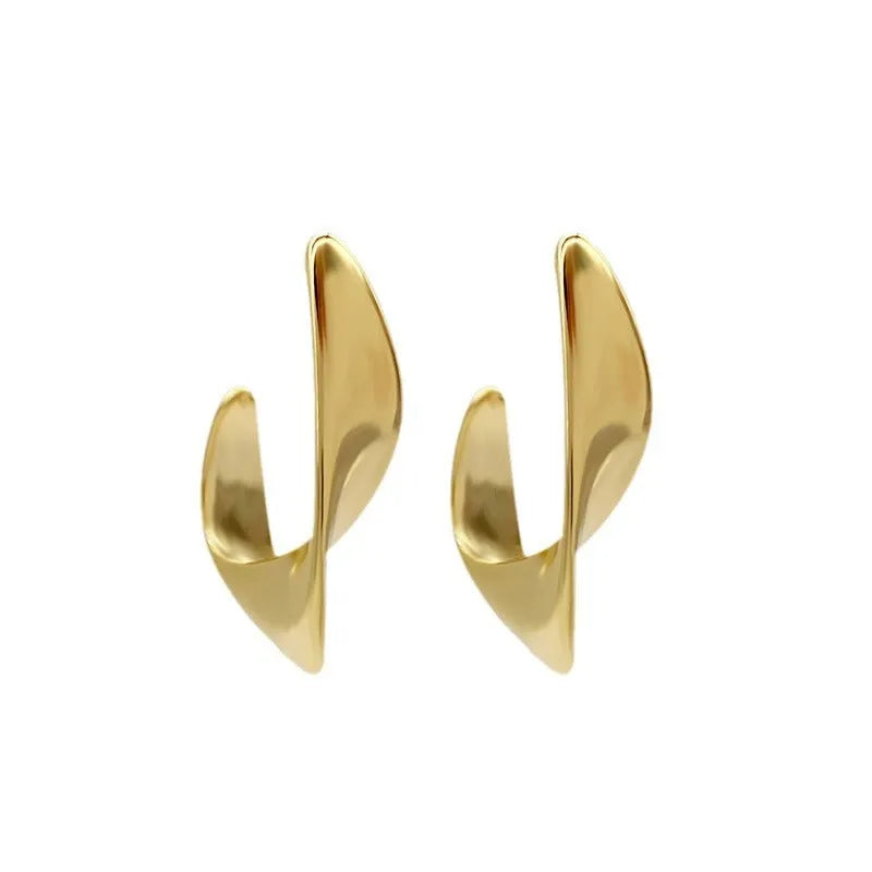 Gold twisted geometric metal earrings with circular elements and electroplated finish