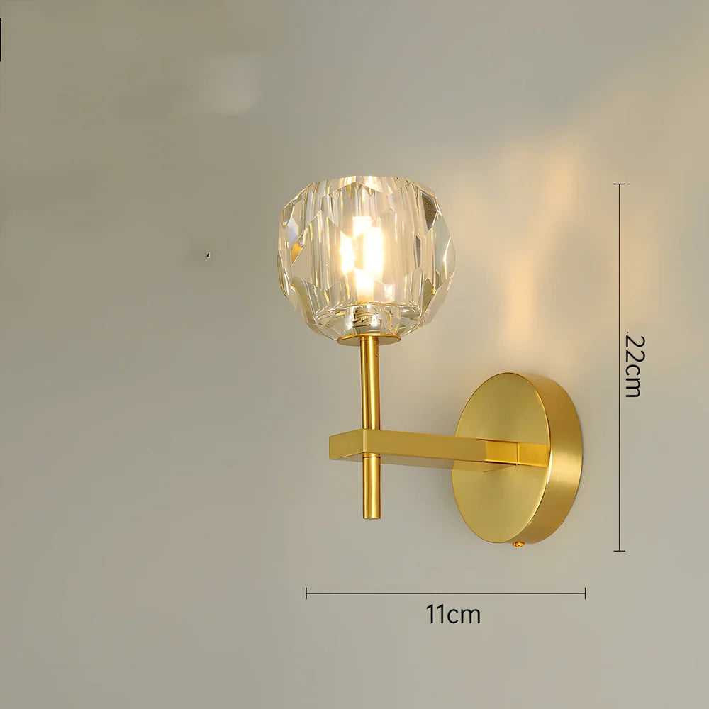 Crystal bedside lamp with stainless steel base and transparent shade providing soft illumination