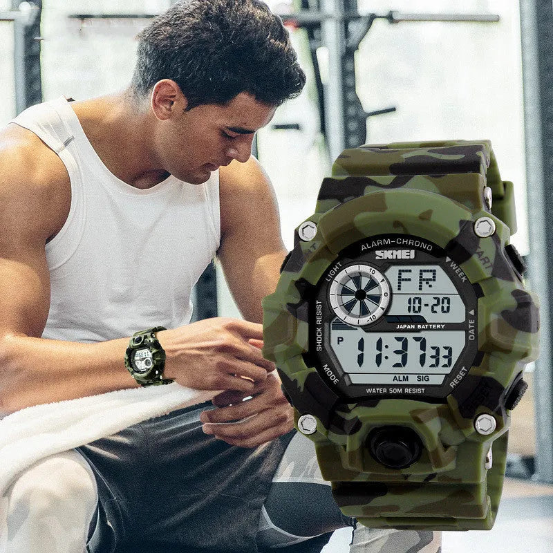 Waterproof electronic watch with round dial, plastic strap, in army green colour, showing alarm and GMT functions.