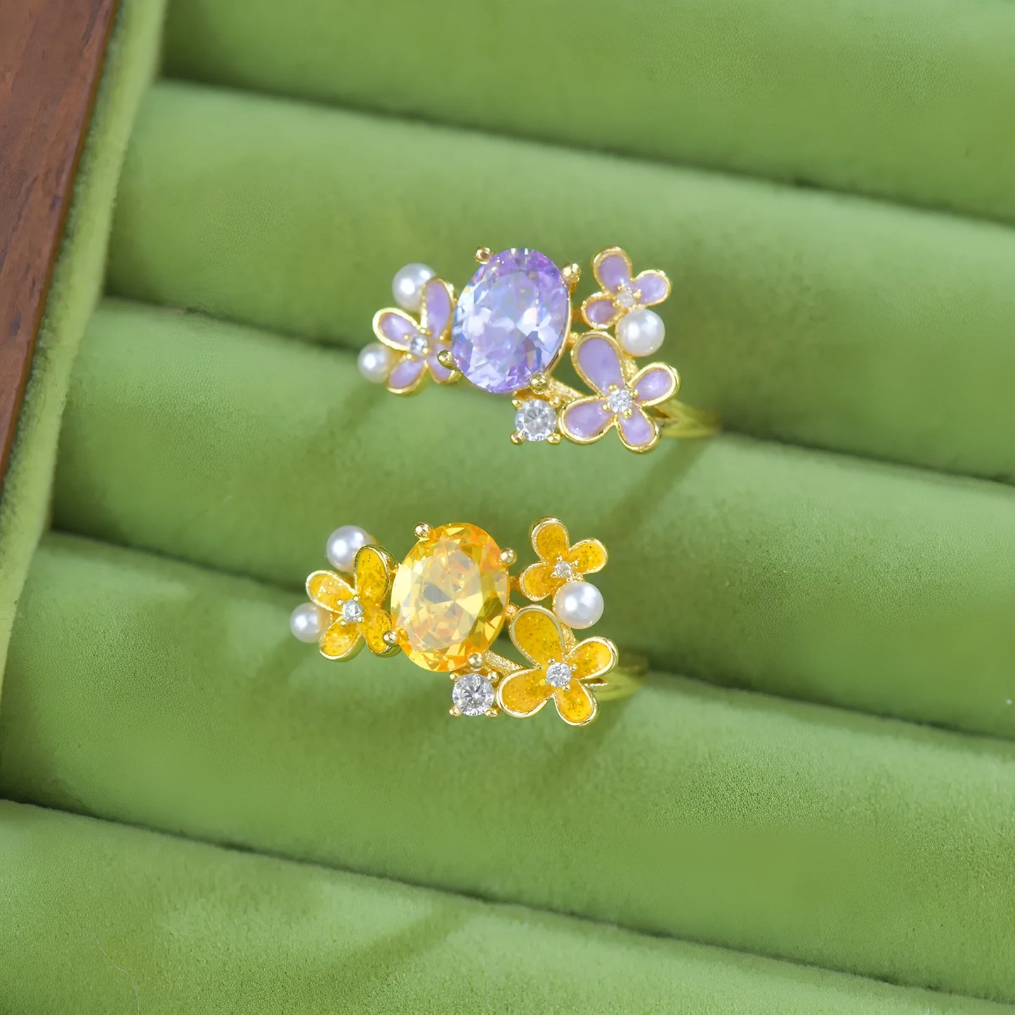 Adjustable open ring with flower design featuring pearl and zircon elements in yellow or light purple finish