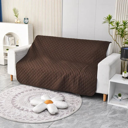 Reversible dog blanket sofa cover in burgundy and grey, laid flat on a sofa