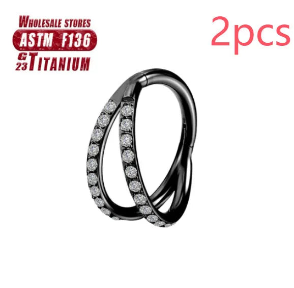 Pair of titanium alloy nose rings on a plain background showing silver, gold, black, and rose gold colour options.