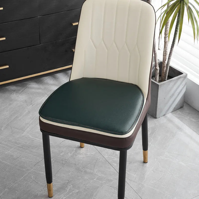 Leather horseshoe-shaped seat cushion in beige colour on a chair, showing non-slip base and 2.5cm thickness.