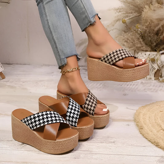Brown and black cross leopard plaid pattern on casual wedge sandals with a rubber sole.