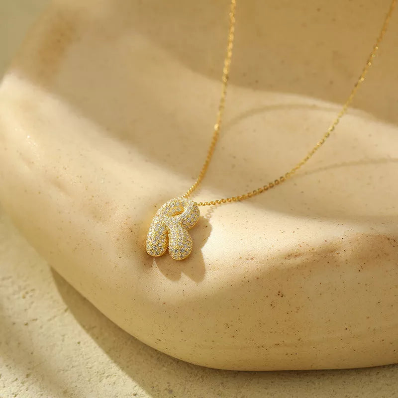 Stainless steel initial pendant necklace with zircon accents, personalized with your choice of letter.