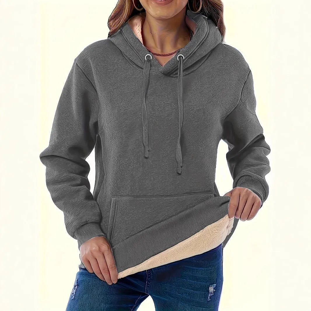 Women's loose fit hooded sweater in thick grey polyester fleece with 3D pattern and front pockets.
