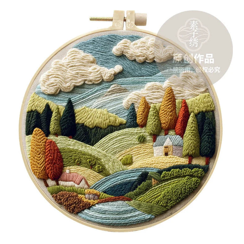Embroidery DIY landscape kit with bamboo frame, printed fabric, thread, and needles for textile art