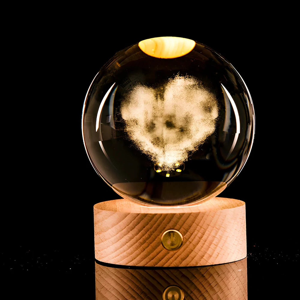 Transparent crystal ball with 3D laser inner carving of galaxy patterns on charging base