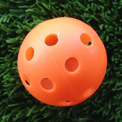Hollow plastic golf practice balls in various colors for indoor use