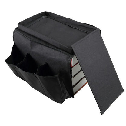 Sofa arm organizer bag in black with multiple pockets for remote controls and magazines