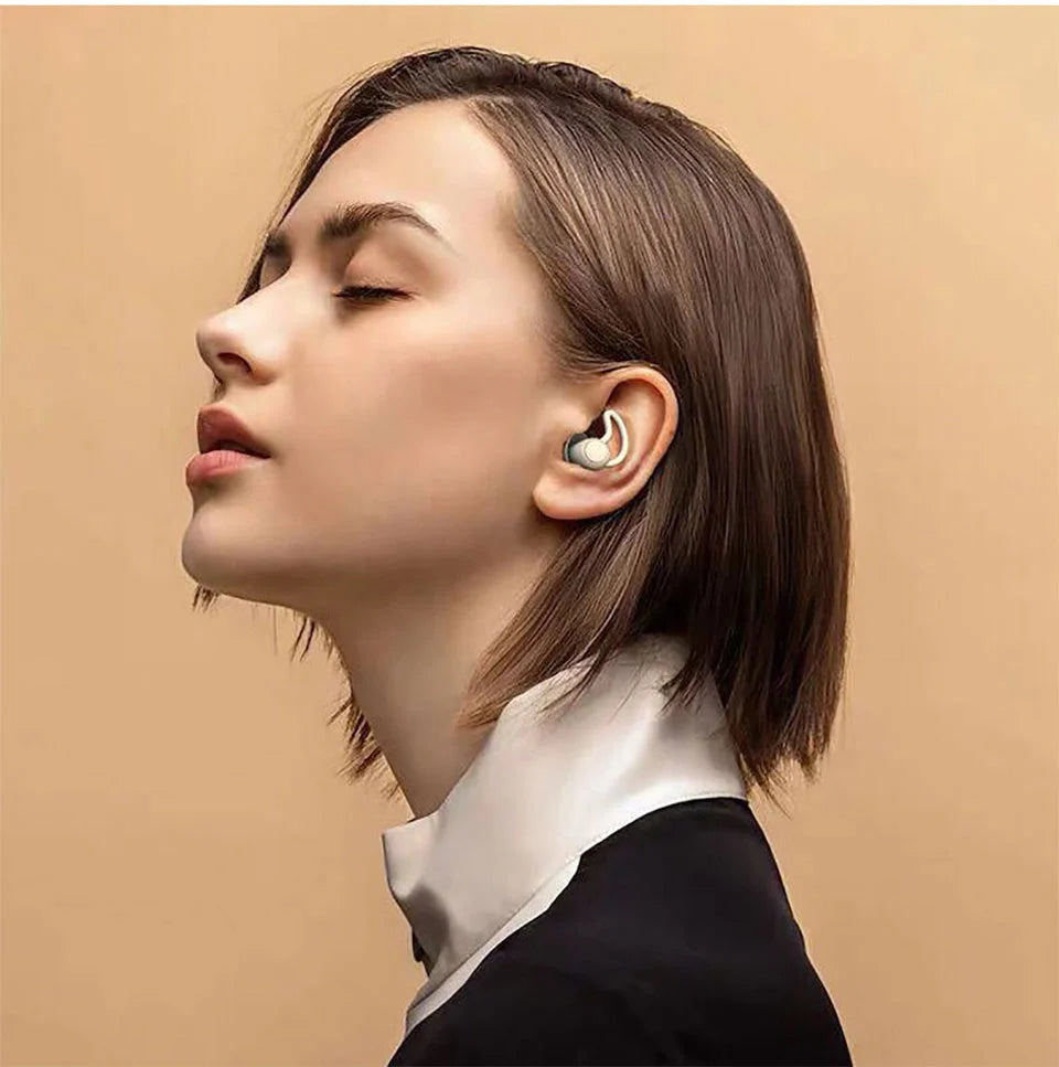 Silicone anti-noise sleep earplugs in grey and black, featuring shark fin design for secure fit