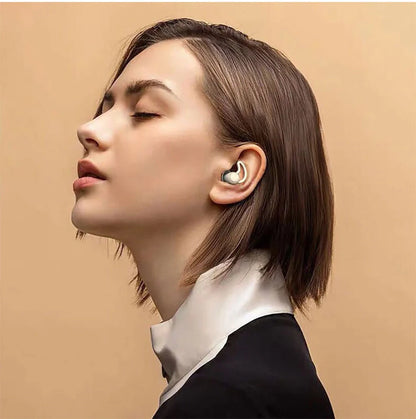 Silicone anti-noise sleep earplugs in grey and black, featuring shark fin design for secure fit