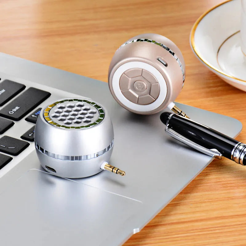 Universal external amplifier speaker in black, rose gold, and local gold colours with 5V power input.