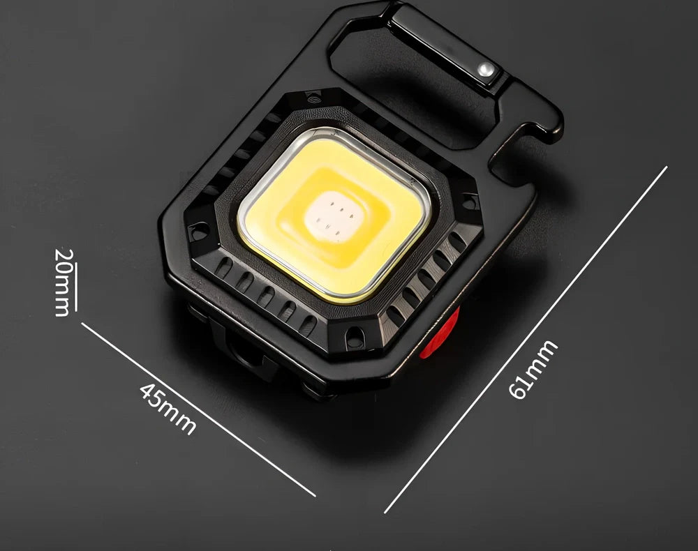 Black portable LED torch showing magnet, bottle opener, and multiple light modes with 500lm brightness