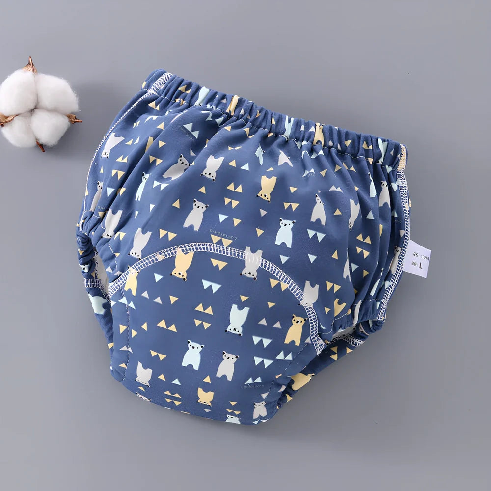 Washable baby training pants with 6-layer gauze construction in assorted patterns including animals and geometric designs