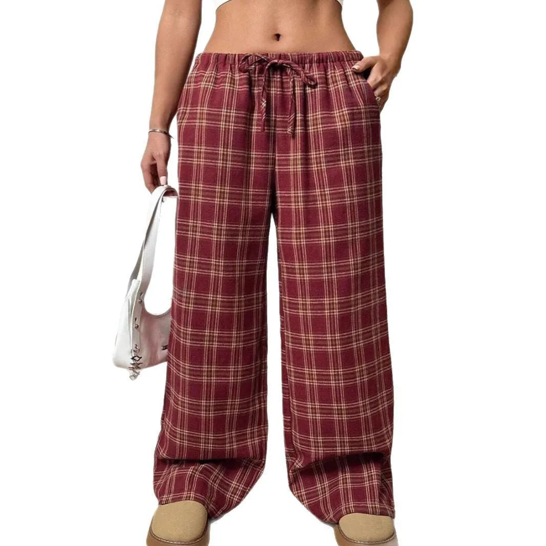 Women's loose plaid trousers with drawstring waist and pockets in red or blue colour options