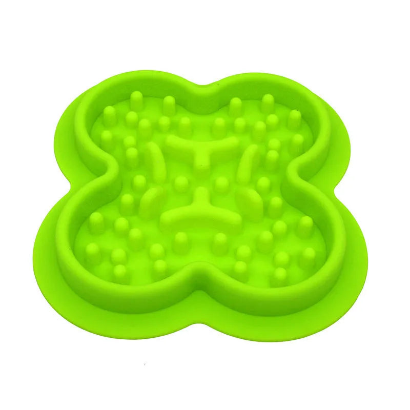 Silicone pet licking mat in green with textured surface and suction cups on base