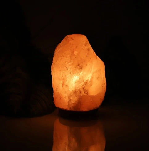 Natural rose crystal salt lamp with rock salt base and soothing glow