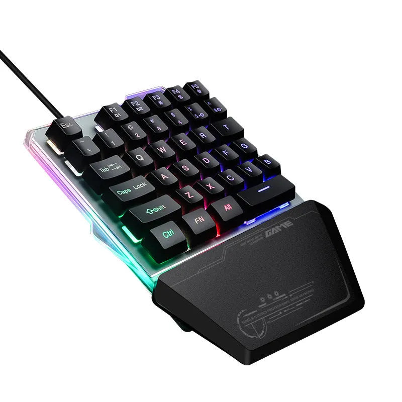 Black one-handed keyboard with RGB backlight and 1.8-metre USB cable on a desk