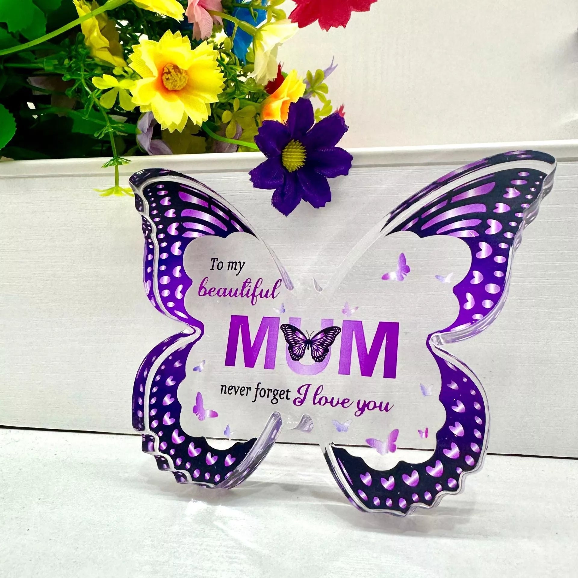 Butterfly-shaped acrylic keepsake with purple wing patterns and personalized message