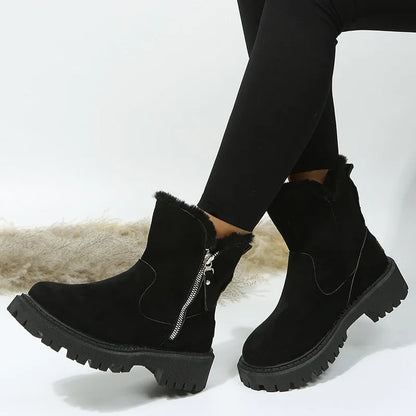 Women's black high top snow boots with a faux suede upper and side zipper on a white background.
