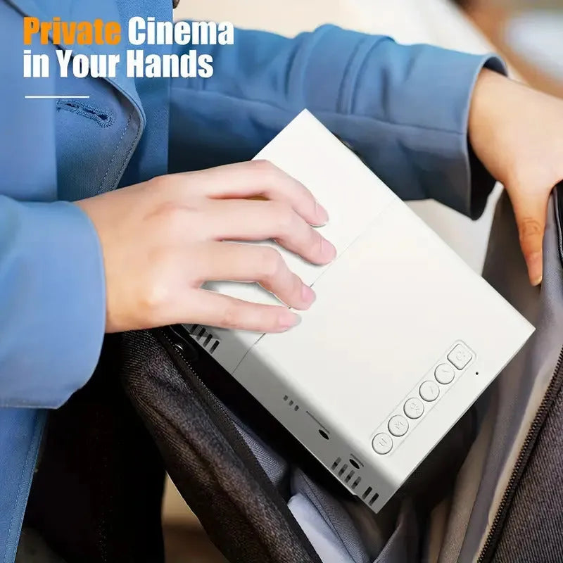 M100 Mini Projector in white or black with 100-inch screen, remote control, and cables for home cinema setup