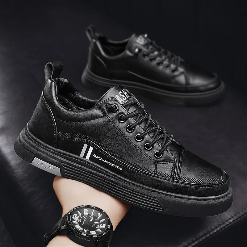 Men's low-top black and white skateboard shoes with elastic band and rubber sole.