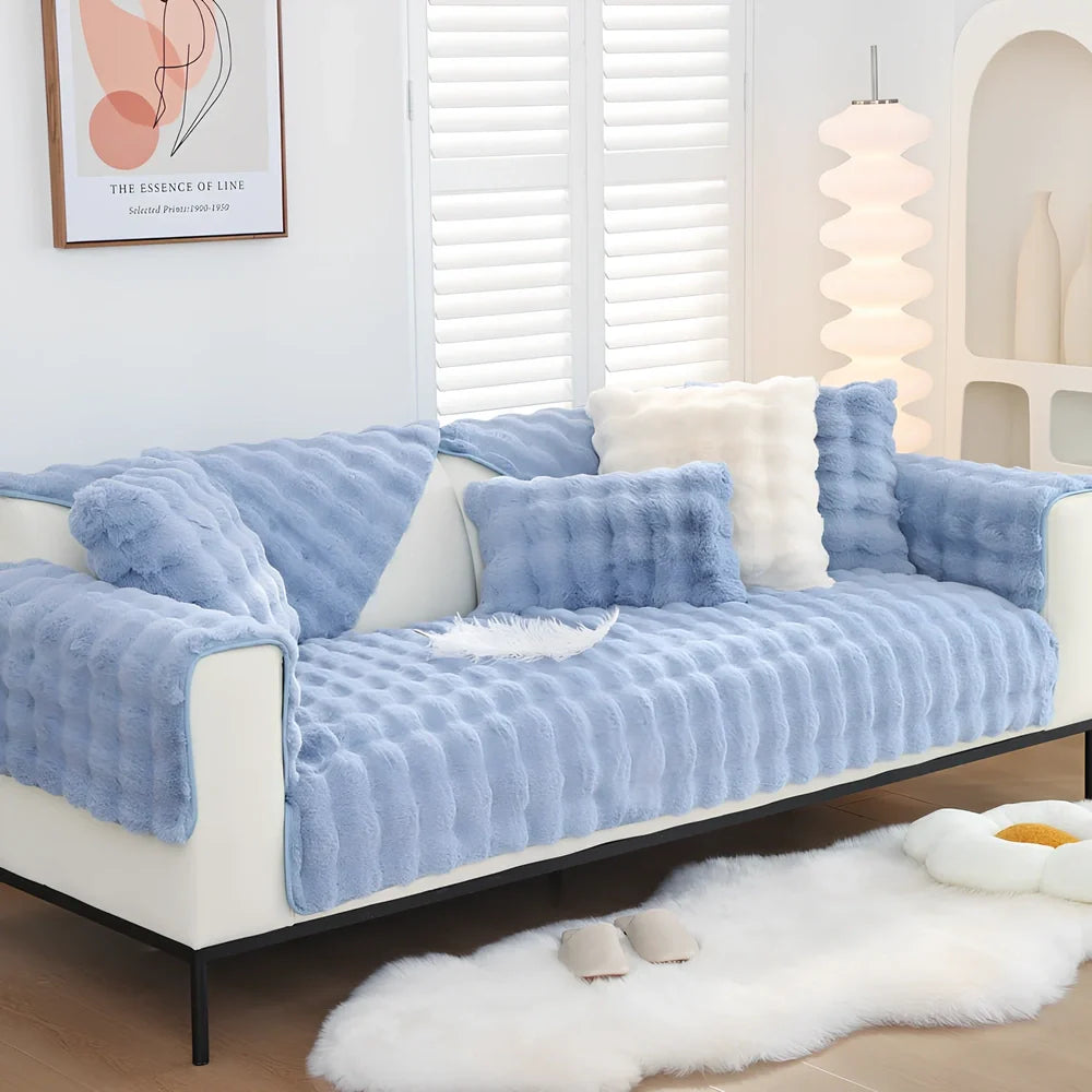 Square flannelette sofa cushion in light blue colour measuring 110x160cm on grey fabric sofa