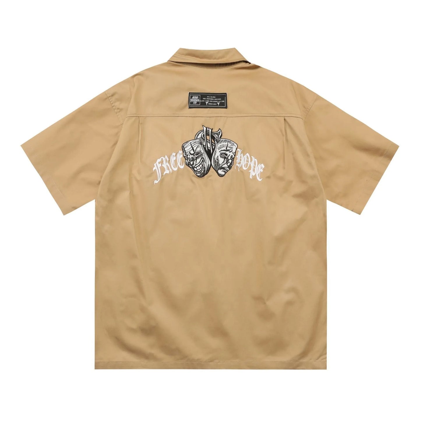 Man wearing a black cotton blend half-sleeve loose fit work shirt with embroidered detail.