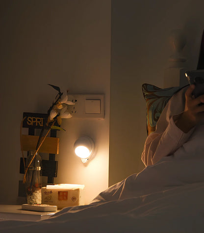 Wireless motion sensor light with USB charging port and adhesive mounting for wall installation