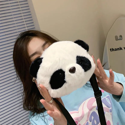 Plush panda head crossbody bag with cylindrical shape measuring 18x15x8cm, showing sandwich pocket and soft texture